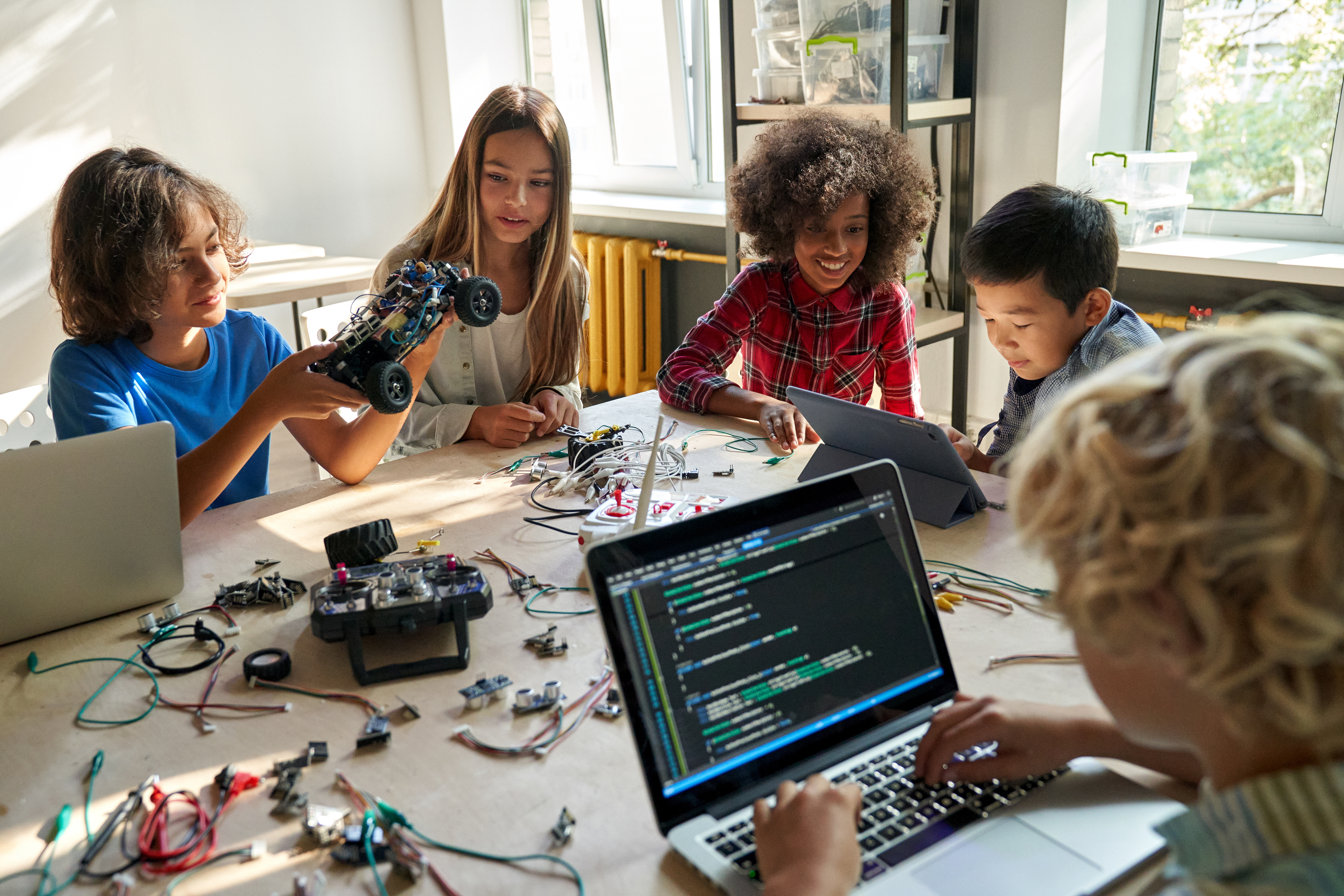 Student coding at a computer